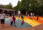 Фотография "JUMPING PILLOW (НАДУВНАЯ ПОДУШКА, БАТУТ)" - уличный аттракцион для прыжков детей, в парк, на пляж, бизнеса из ткань ПВХ ТаймТриал